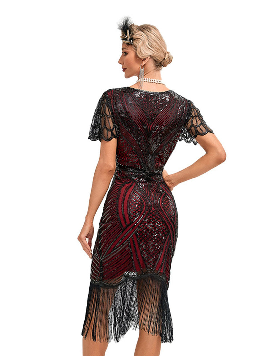 She slips into this 1920s Cap Sleeves Tassel Sequined Dress and suddenly it&