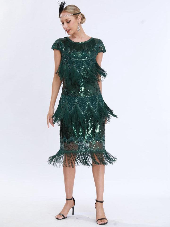 This 1920s Charleston Sequins Tassel Patchwork Dress wraps her in 1920s elegance, one twirl at a time