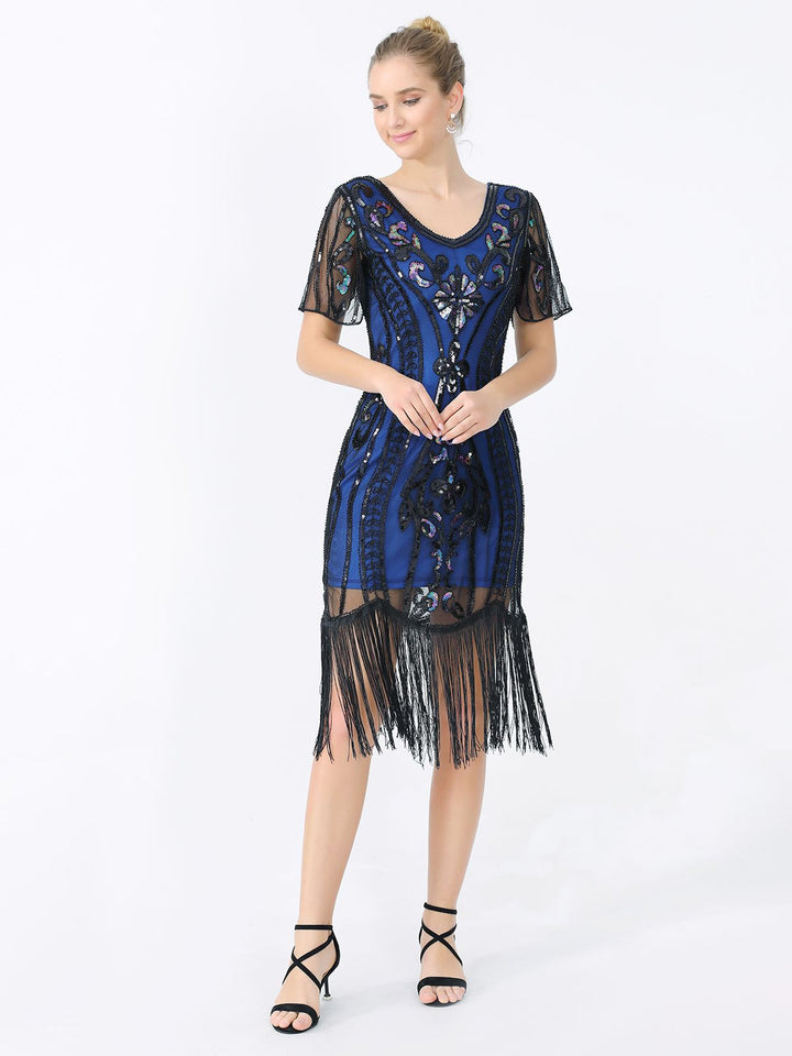 She slips into this 1920s Fringe Sequin Flapper Dress and suddenly it&
