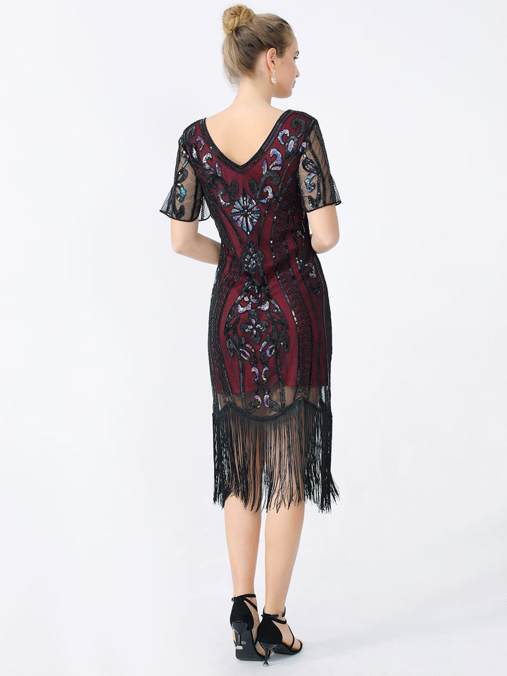 She slips into this 1920s Fringe Sequin Flapper Dress and suddenly it&