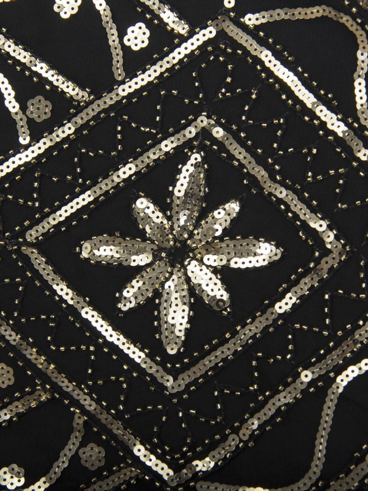 This 1920s Gatsby Sheer Neck Tassel Sequins Dress wraps her in 1920s elegance, one twirl at a time