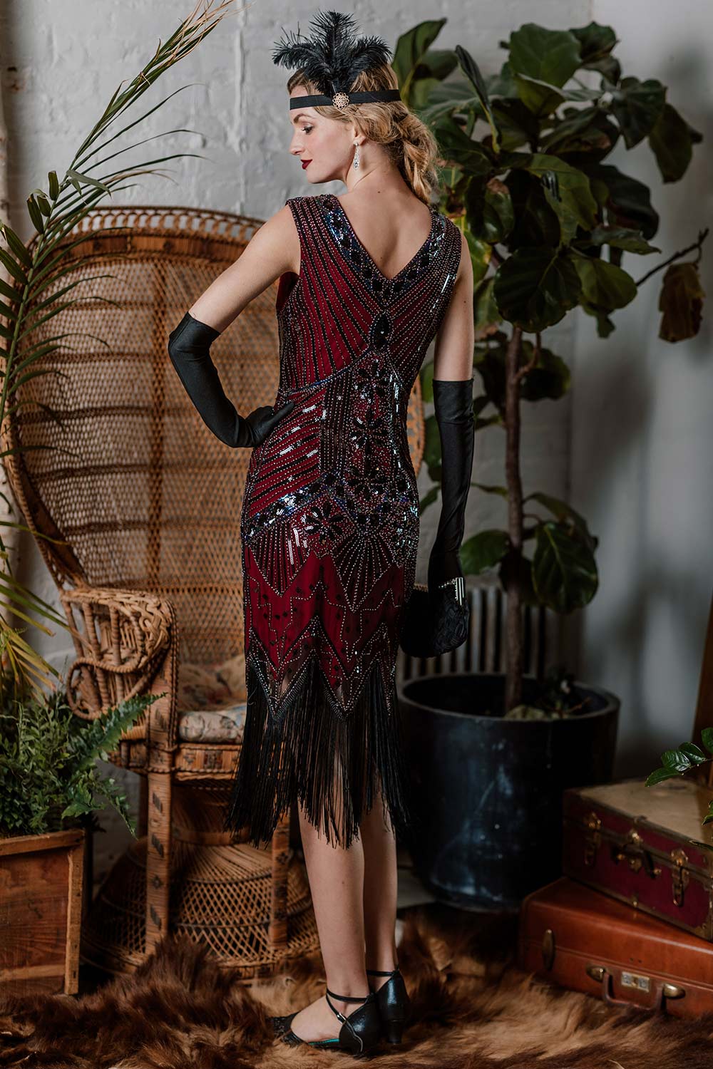 This 1920s Sequined Fringe Dress wraps her in 1920s elegance, one twirl at a time