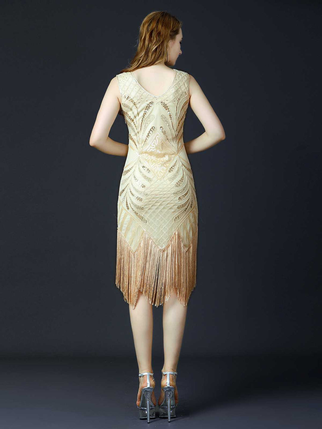 She slips into this 1920s Sequined Fringe Flapper Sleeveless Dress and suddenly it&