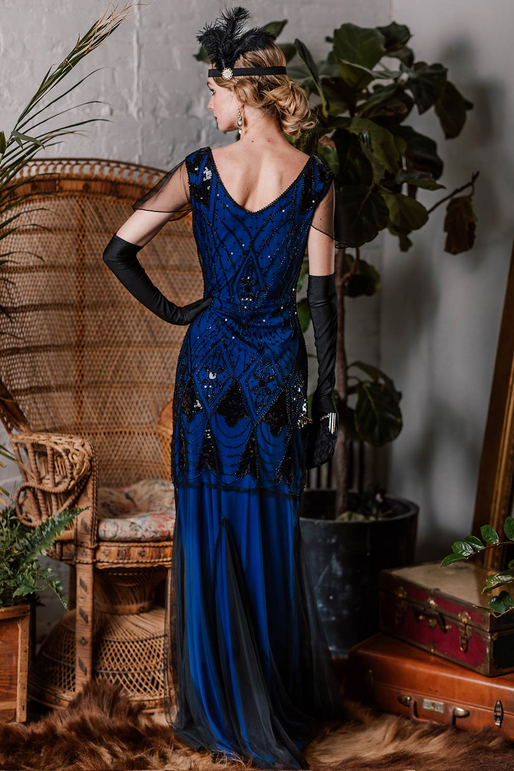 She wears 1920s Sequined Maxi Flapper Dress with 1920s grace