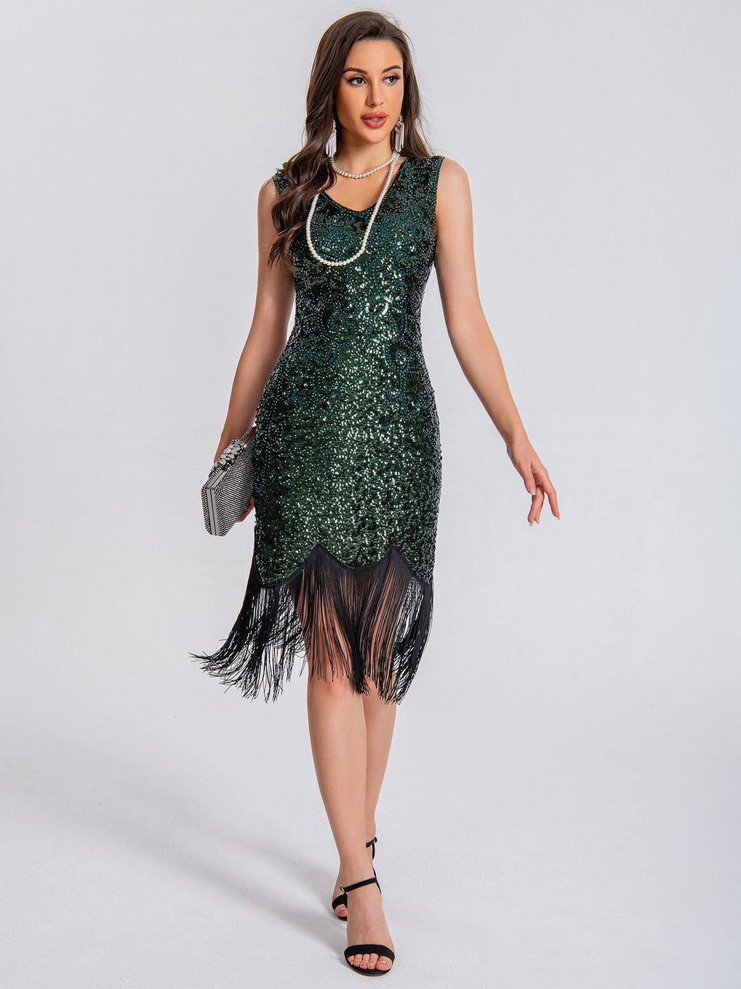 She slips into this 1920s V-Neck Symmetrical Pattern Tassel Sequined Dress and suddenly it&