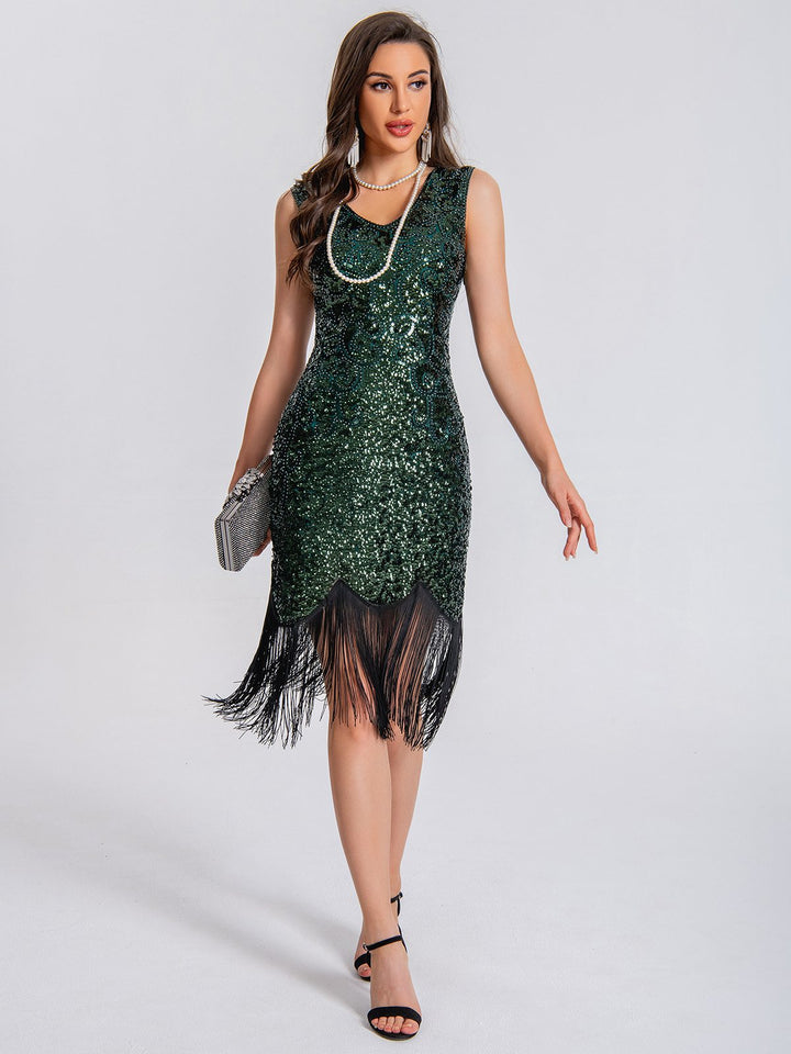 She slips into this 1920s V-Neck Symmetrical Pattern Tassel Sequined Dress and suddenly it&