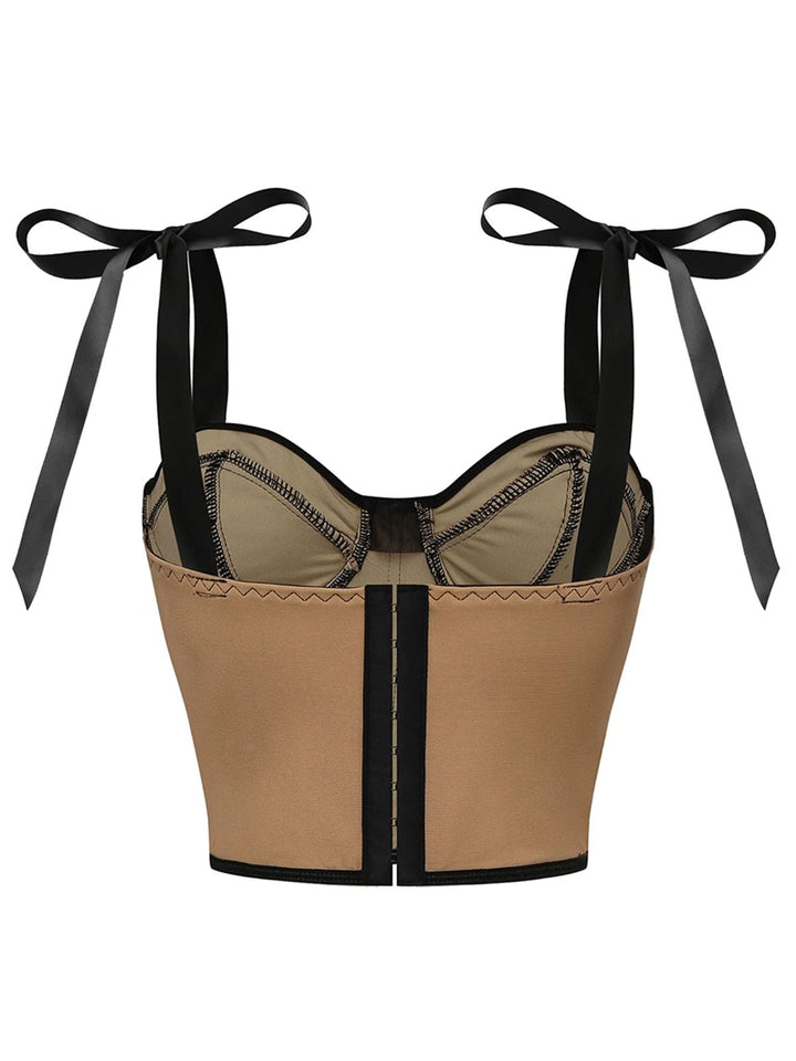 This 1940s Lace-Up Bow Mesh Corset Crop Camisole brings 1940s soul to her everyday