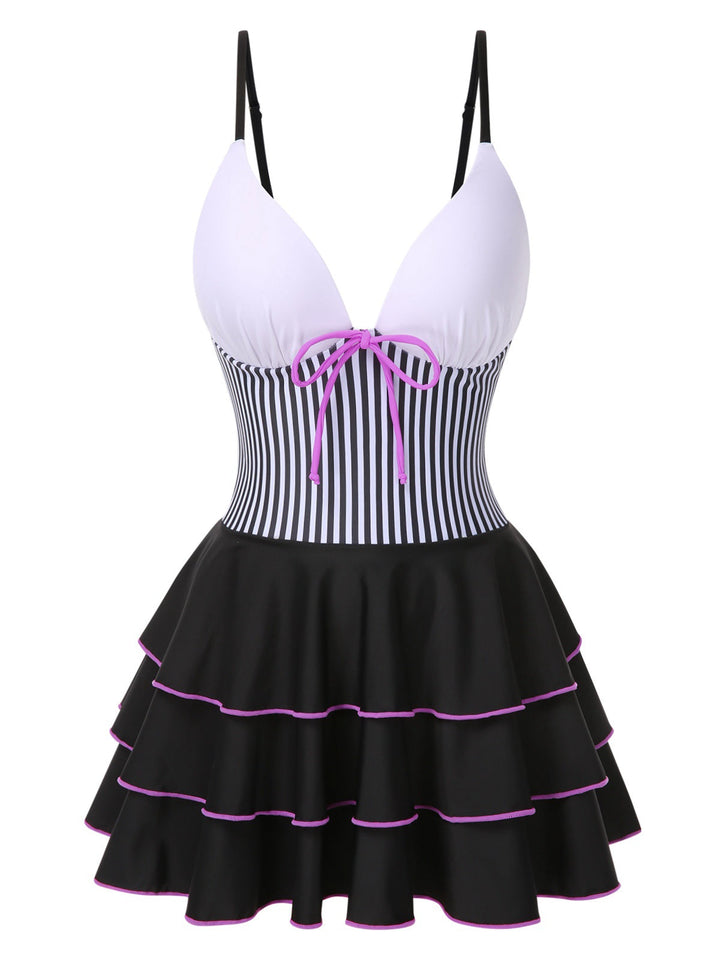 She slips into this 1940s Stripe Patchwork Layered Hem Swim Dress and suddenly it&