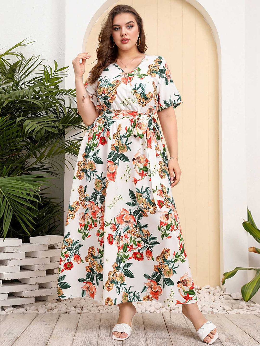 She slips into this 1940s Surplice V-Neck Belted Floral Dress and suddenly it&
