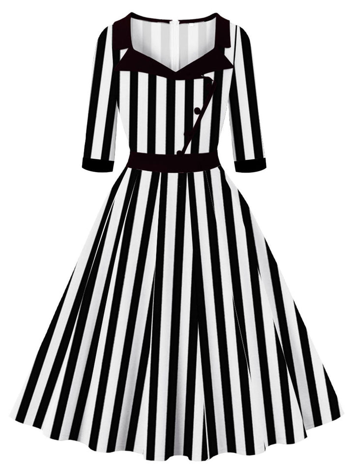 She slips into this 1950S Lapel Black &amp; White Stripes Dress and suddenly it&