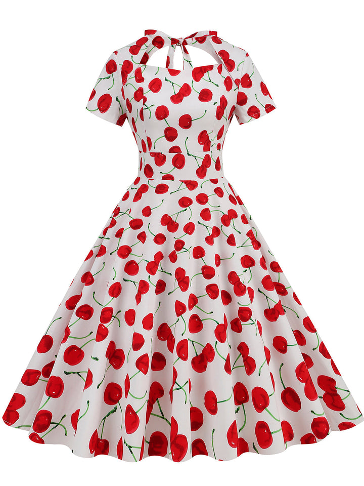 She slips into this 1950s Cherry Sweetheart Short Sleeve Lace Up Dress and suddenly it&