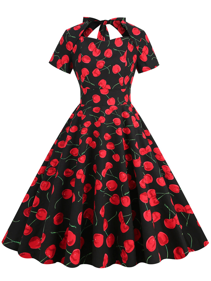 She slips into this 1950s Cherry Sweetheart Short Sleeve Lace Up Dress and suddenly it&