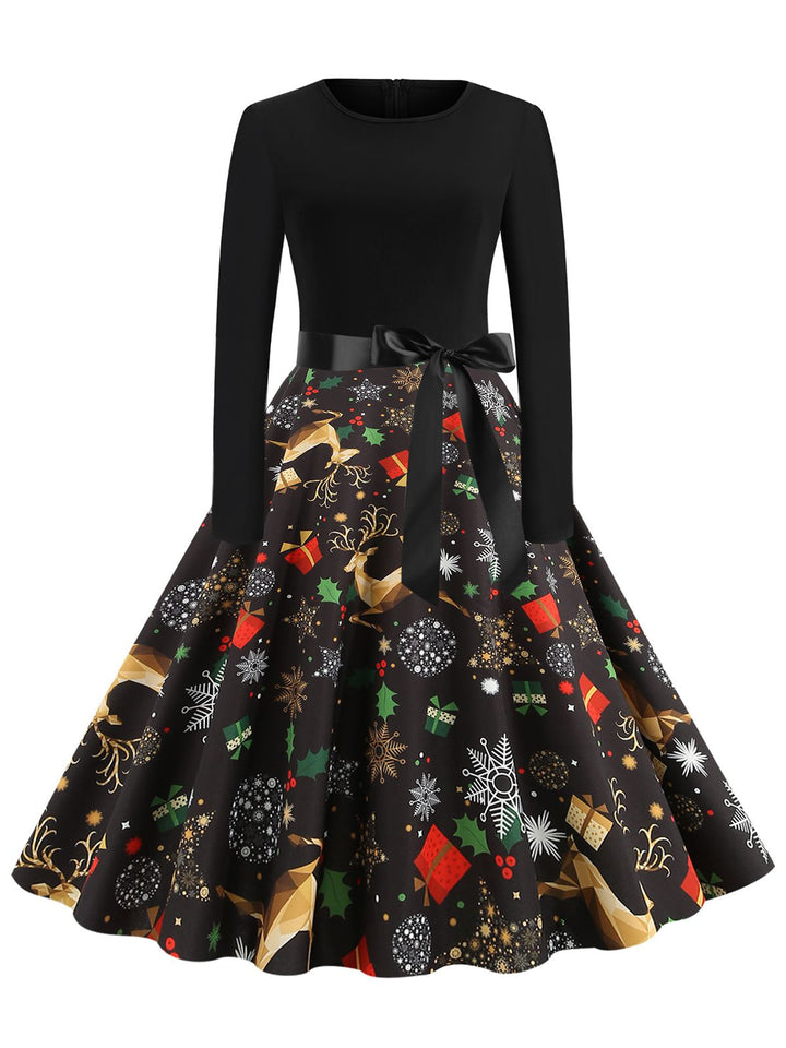 She slips into this 1950s Christmas Print Belted Dress and suddenly it&