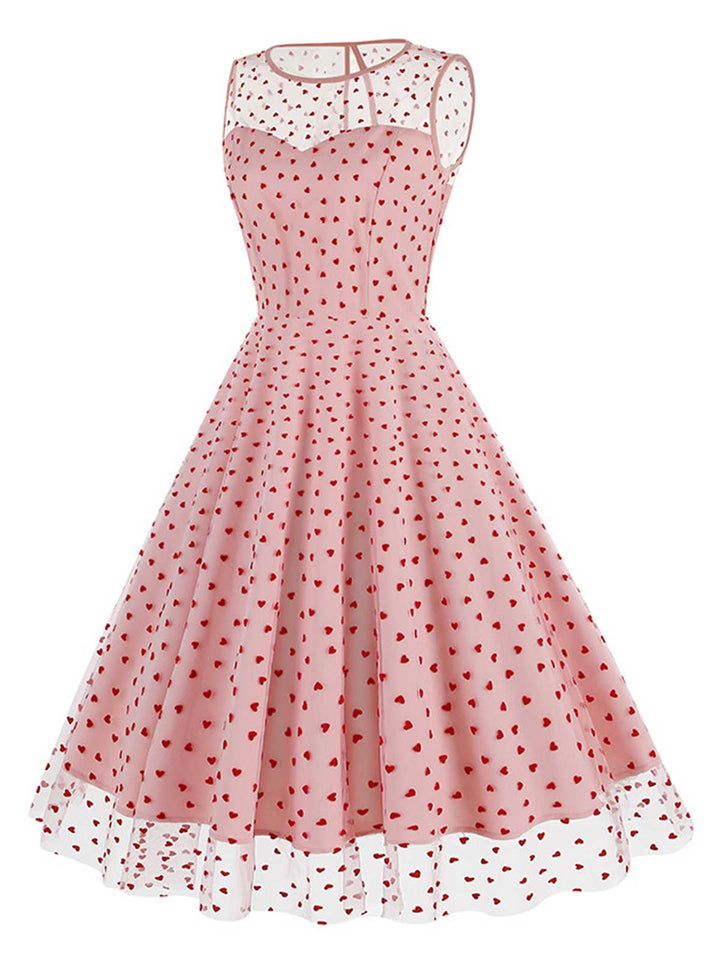 She slips into this 1950s Flocked Heart Mesh Patchwork Dress and suddenly it&