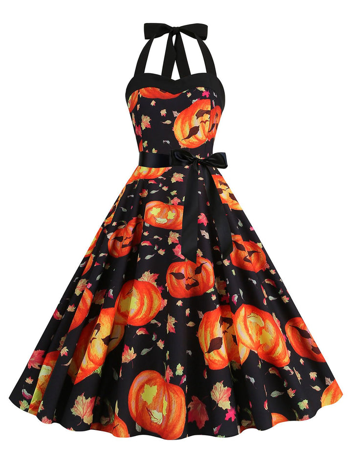 She slips into this 1950s Halloween Pumpkin Face Halter Dress and suddenly it&