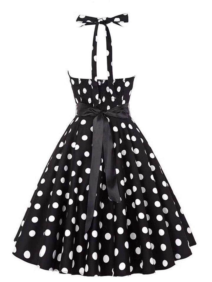 This 1950s Halter Contrast Polka Dots Belted Dress wraps her in 1950s elegance, one twirl at a time