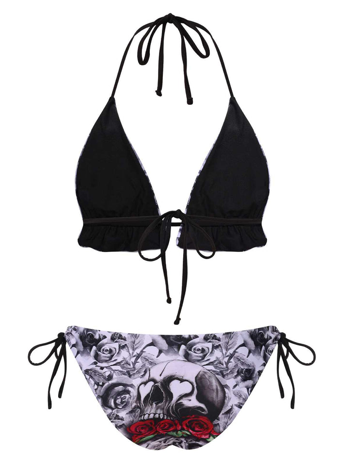 This 1950s Halter Gothic Skull Roses Swimsuit carries 1950s vacation dreams in every stitch