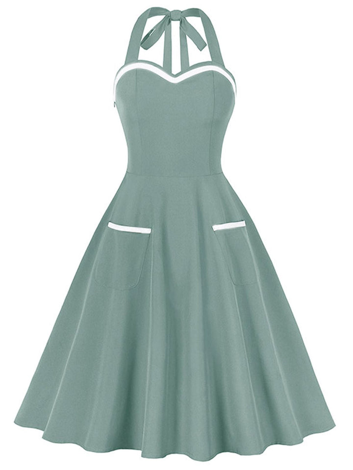 1950s Halter Pockets Backless Swing Dress — a 1950s silhouette that turns sidewalks into runways