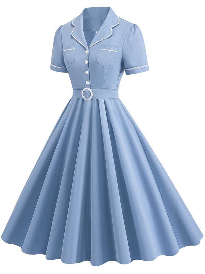 She slips into this 1950s Lapel Belted Solid Dress and suddenly it&