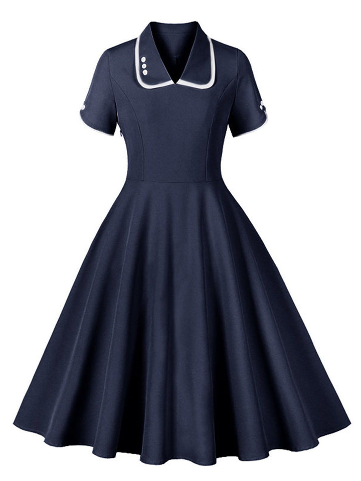She slips into this 1950s Lapel Buttoned Short Sleeve Solid Dress and suddenly it&