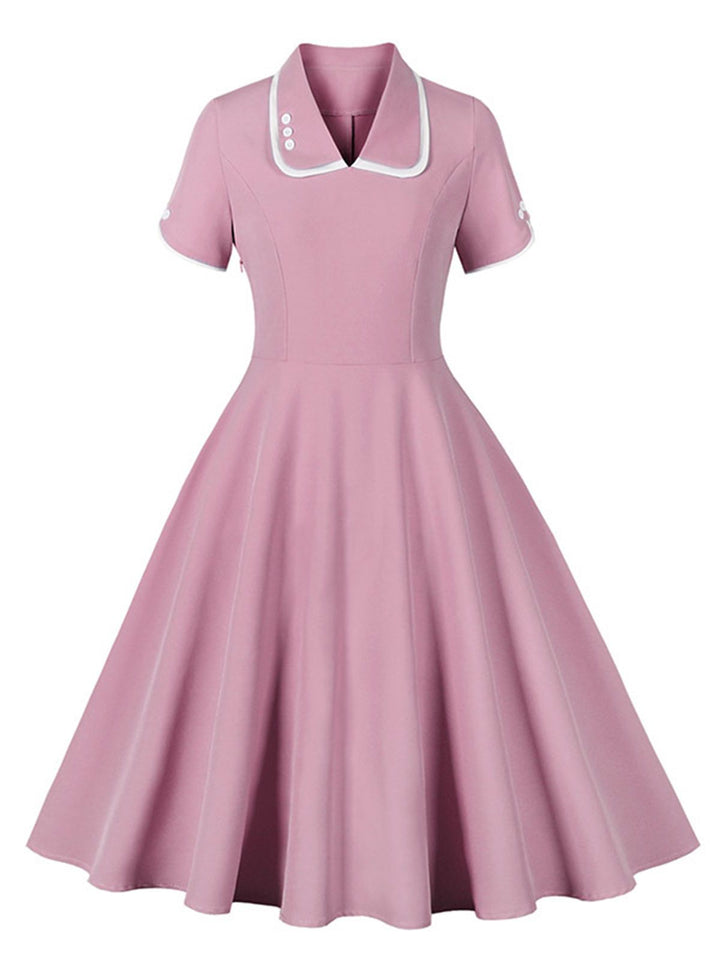 She slips into this 1950s Lapel Buttoned Short Sleeve Solid Dress and suddenly it&
