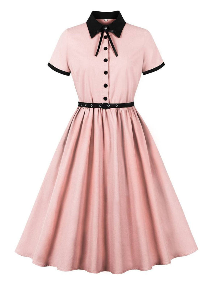 She slips into this 1950s Lapel Colorblock Swing Shirt Dress and suddenly it&