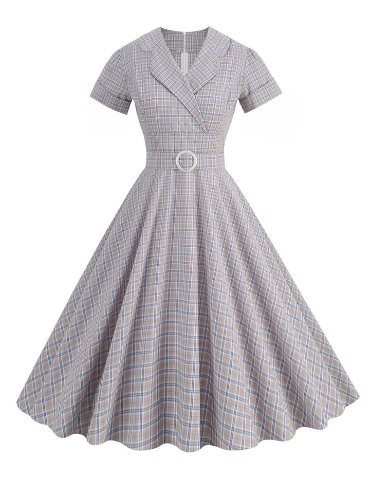 She slips into this 1950s Lapel Plaids Belted Dress and suddenly it&