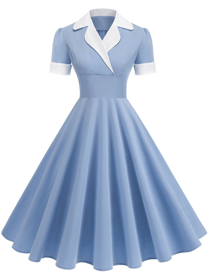 She slips into this 1950s Notched Collar Colorblock Swing Dress and suddenly it&