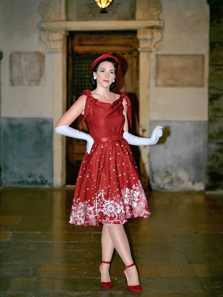 She slips into this 1950s Off-shoulder Snowflake Dress and suddenly it&