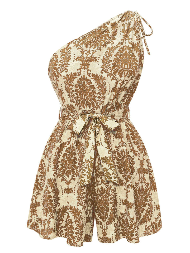 She adds this 1950s One Shoulder Floral Print Belted Romper and suddenly it&