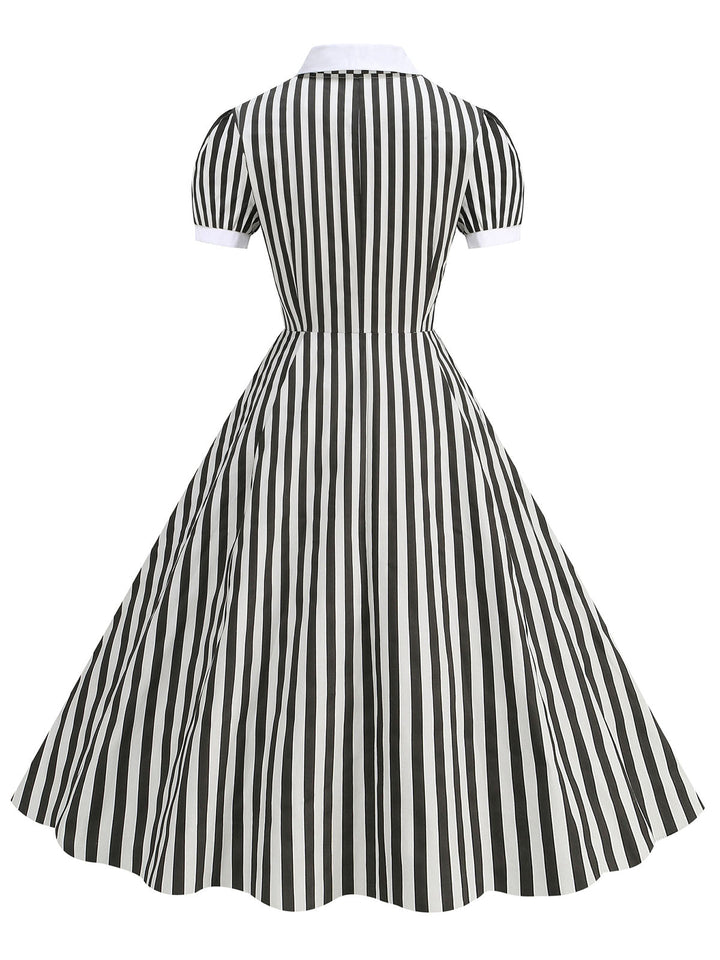 This 1950s Peter Pan Collar Black &amp; White Stripes Dress wraps her in 1950s elegance, one twirl at a time