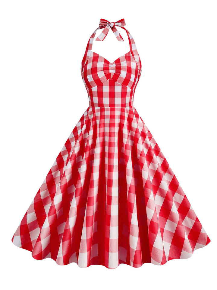 She slips into this 1950s Plaid Halter Swing Dress and suddenly it&