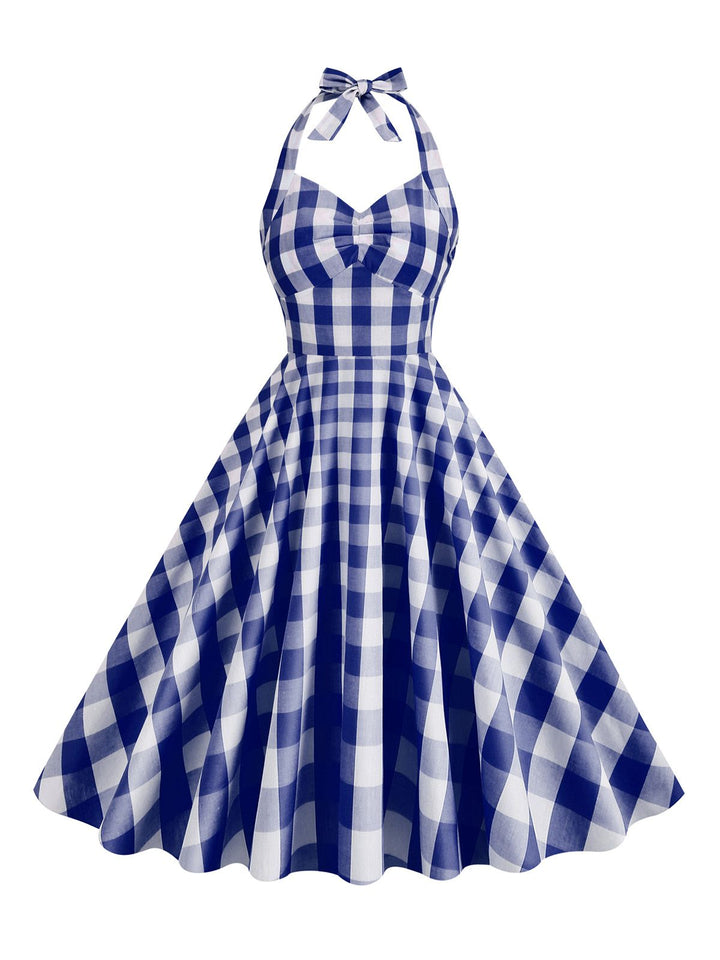 She slips into this 1950s Plaid Halter Swing Dress and suddenly it&