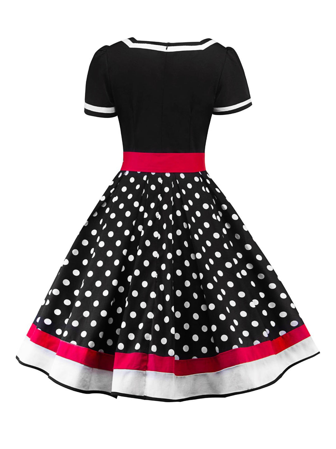 She wears 1950s Polka Dot Belted Patchwork Dress with vintage grace