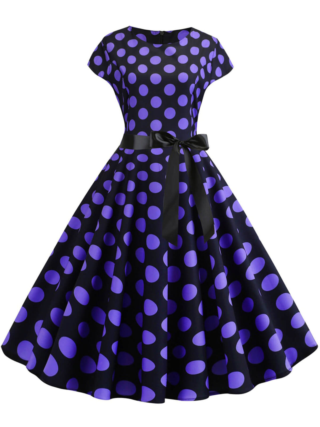 She slips into this 1950s Polka Dot Cap Sleeved Dress and suddenly it&