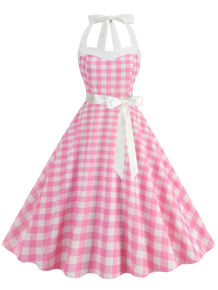 She slips into this 1950s Polka Dot Halter Belt Swing Dress and suddenly it&