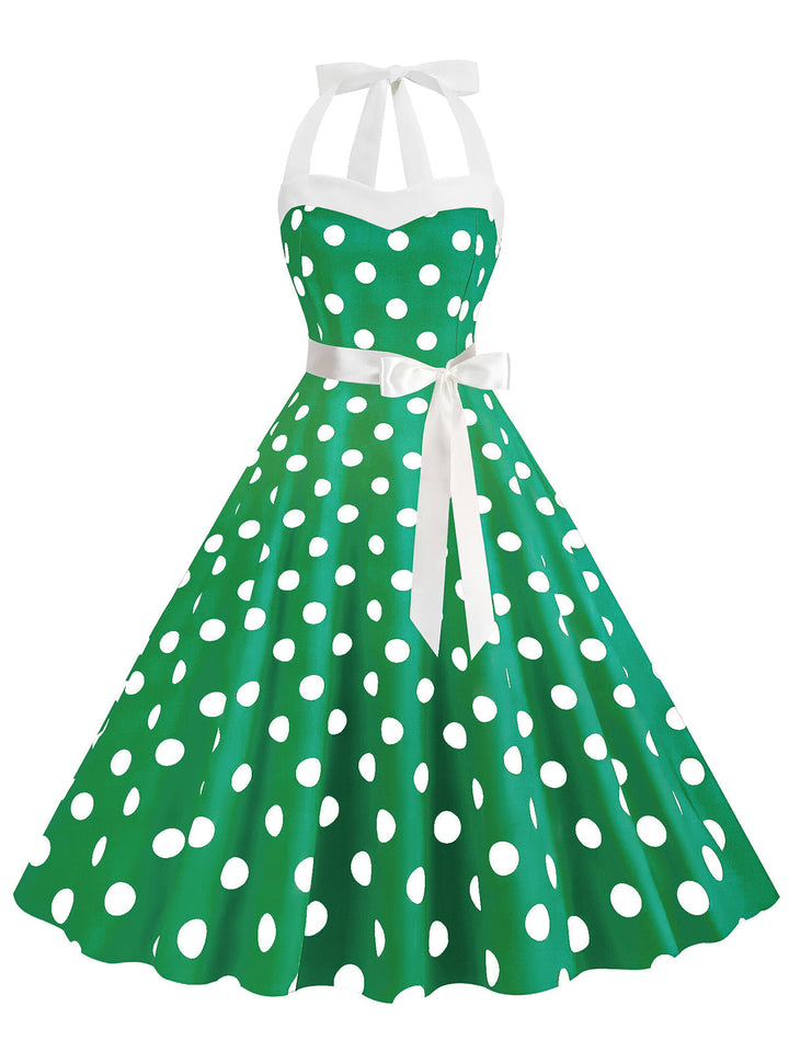 She slips into this 1950s Polka Dot Halter Belt Swing Dress and suddenly it&