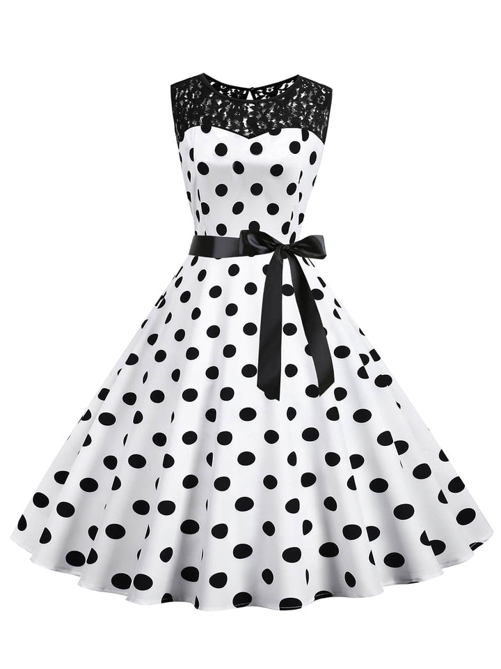 She slips into this 1950s Polka Dot Lace Patchwork Dress and suddenly it&
