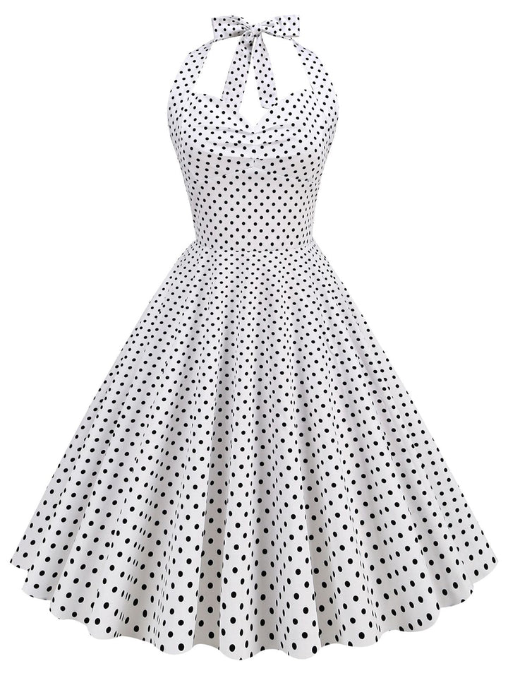 She slips into this 1950s Polka Dots Lace Up Halter Swing Dress and suddenly it&