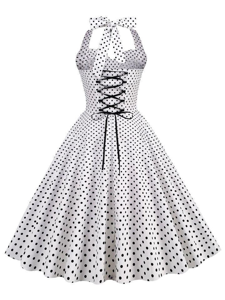 This 1950s Polka Dots Lace Up Halter Swing Dress wraps her in 1950s elegance, one twirl at a time