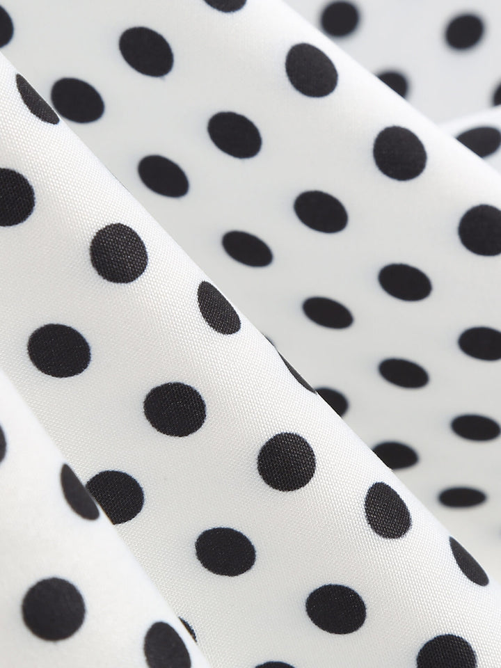 This 1950s Polka Dots Patchwork Ribbon Strap Dress wraps her in 1950s elegance, one twirl at a time