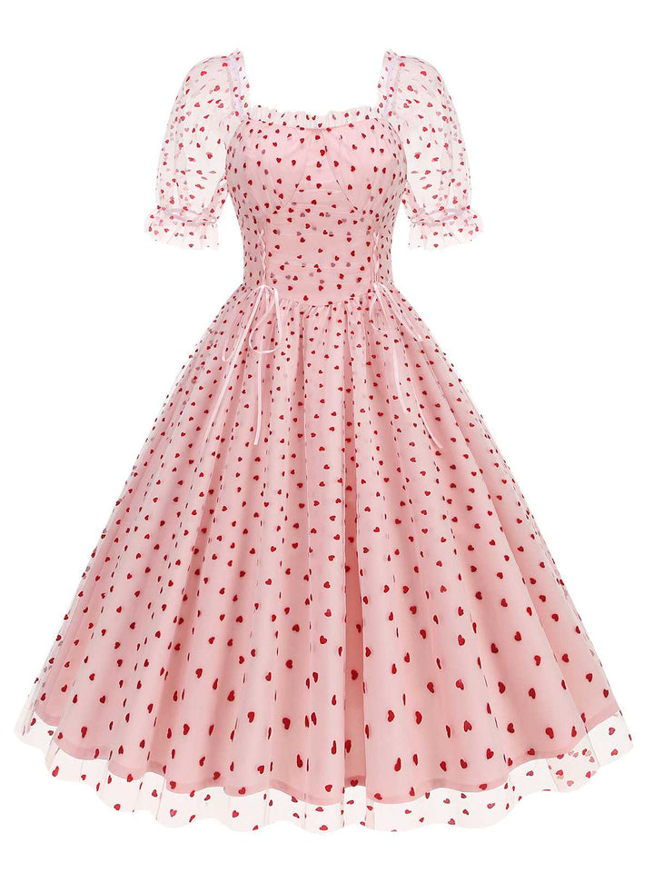 She slips into this 1950s Puff Sleeve Valentine Heart Mesh Dress and suddenly it&