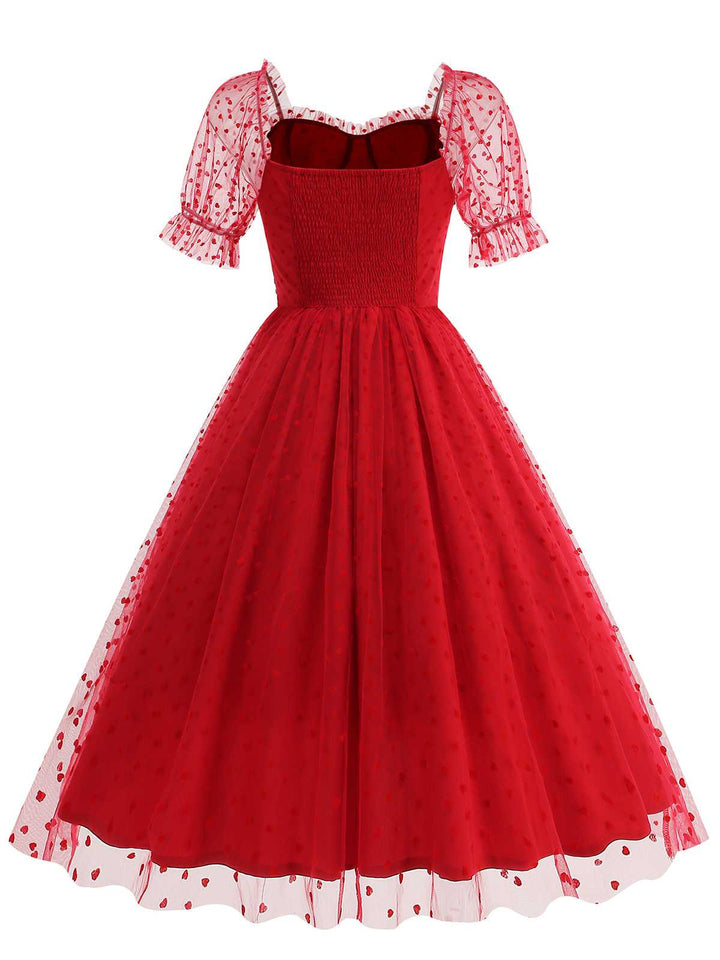She slips into this 1950s Puff Sleeve Valentine Heart Mesh Dress and suddenly it&