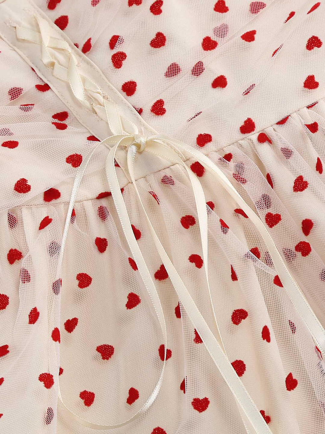 She slips into this 1950s Puff Sleeve Valentine Heart Mesh Dress and suddenly it&