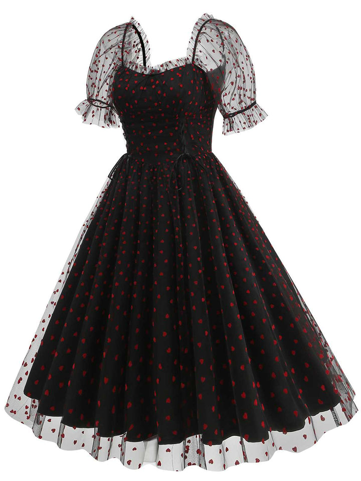 She slips into this 1950s Puff Sleeve Valentine Heart Mesh Dress and suddenly it&