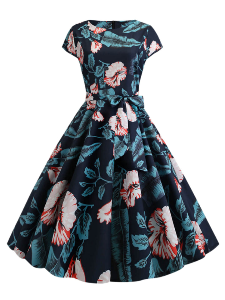 She slips into this 1950s Retro Floral Swing Dress and suddenly it&