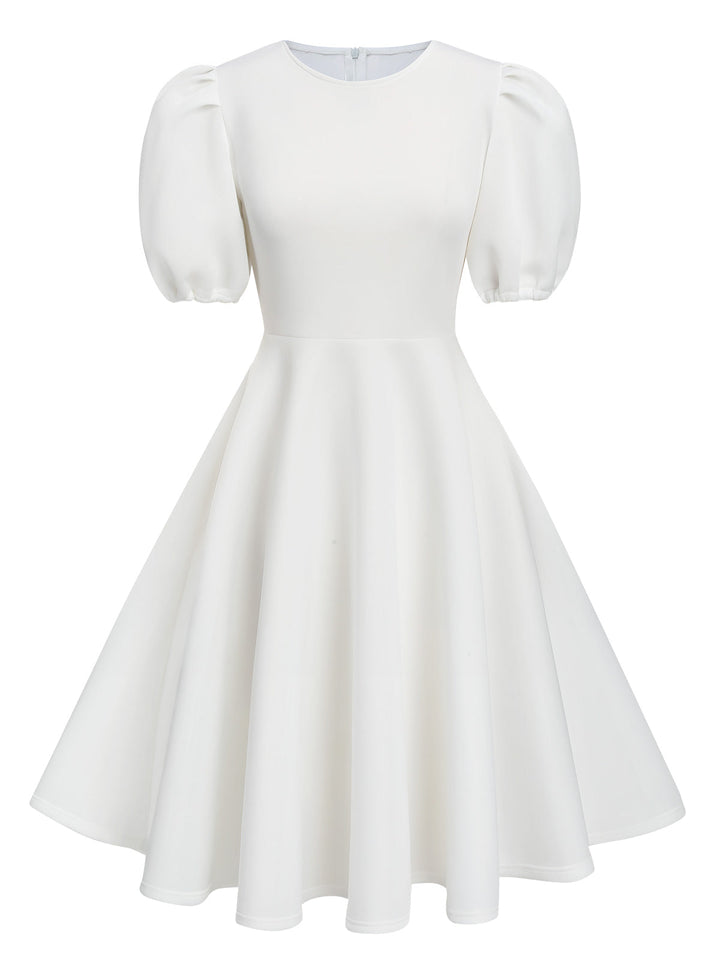 She slips into this 1950s Round Neck Puff Sleeve A-Line Dress and suddenly it&