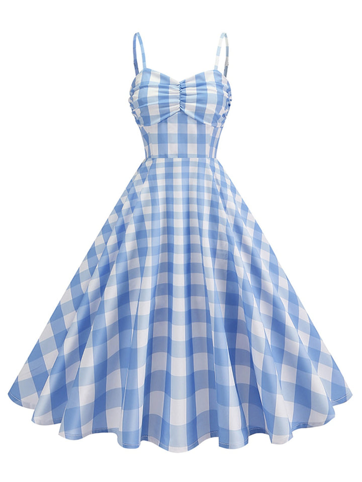 She slips into this 1950s Ruched Spaghetti Straps Gingham Plaid Dress and suddenly it&