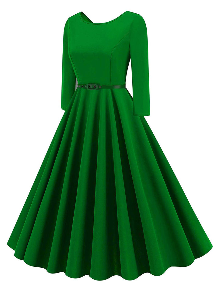 She slips into this 1950s Solid Belted Swing Dress and suddenly it&