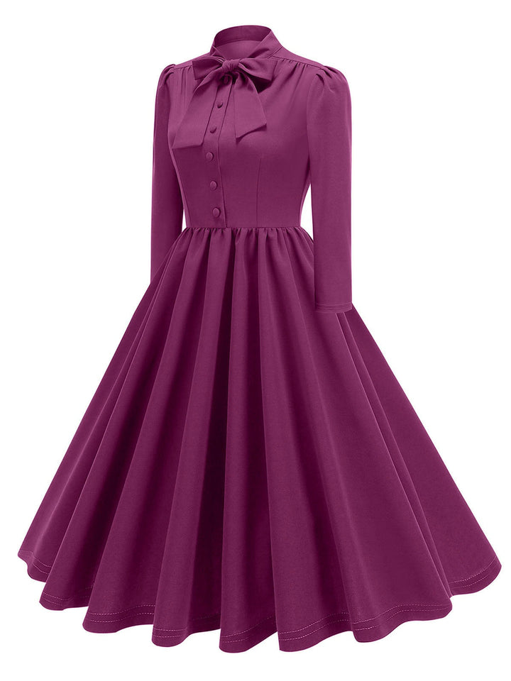 This 1950s Solid Bow Collar Buttoned Swing Dress wraps her in 1950s elegance, one twirl at a time
